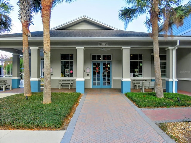 view of exterior entry with covered porch