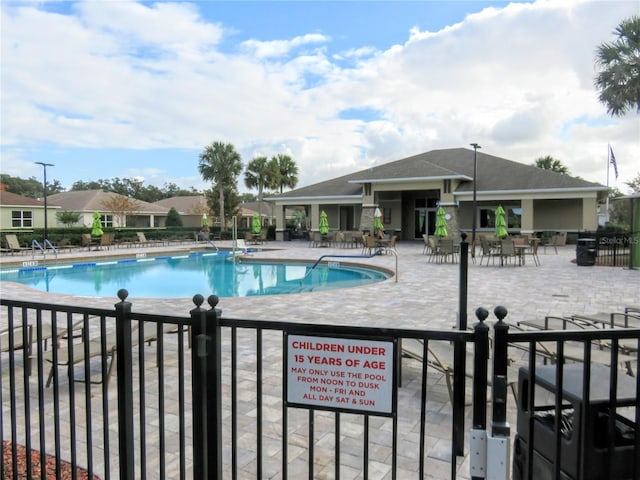 view of swimming pool with a patio area