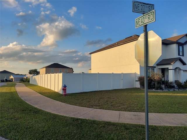 view of side of home featuring a lawn