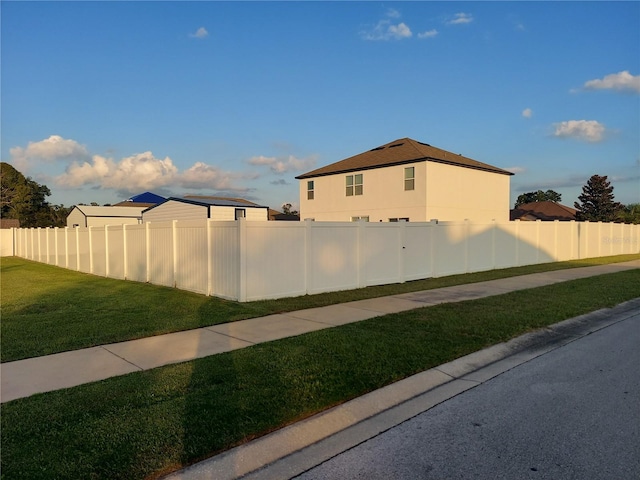 view of property exterior featuring a lawn