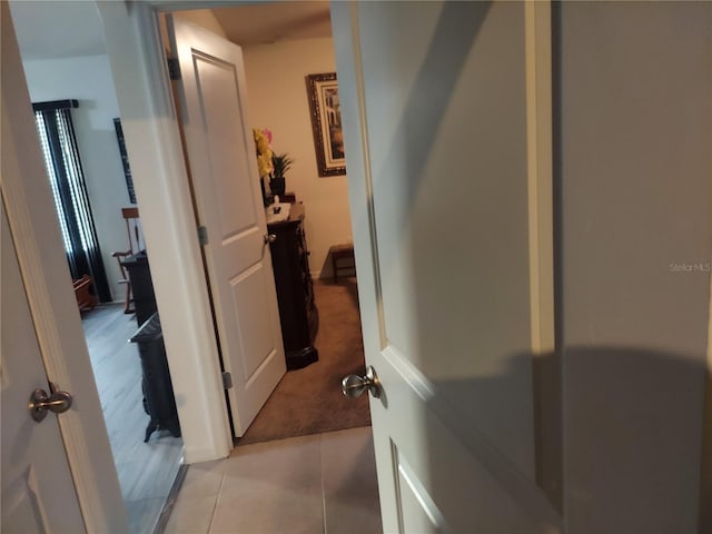 hallway featuring light tile patterned floors