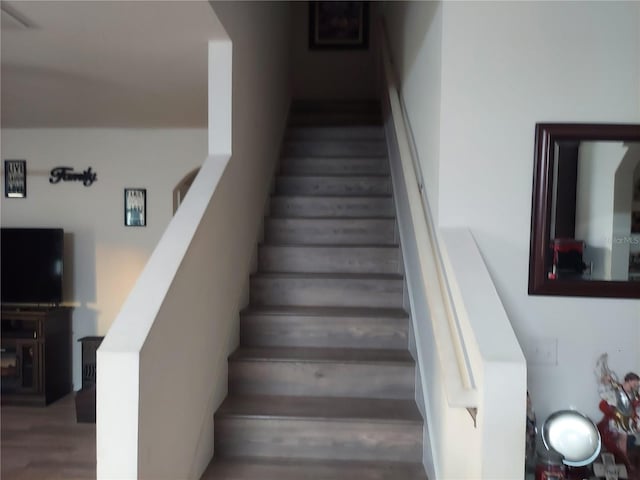 staircase featuring hardwood / wood-style floors