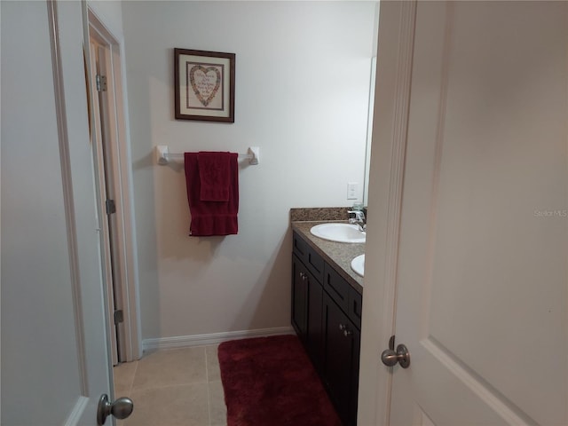 bathroom featuring tile patterned flooring and vanity