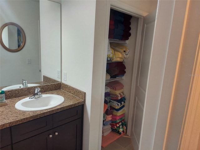 bathroom with tile patterned flooring and vanity