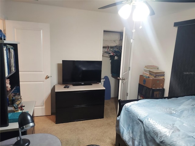 bedroom featuring light carpet and ceiling fan