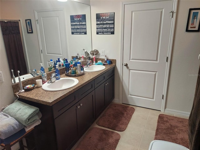 bathroom with vanity and tile patterned floors