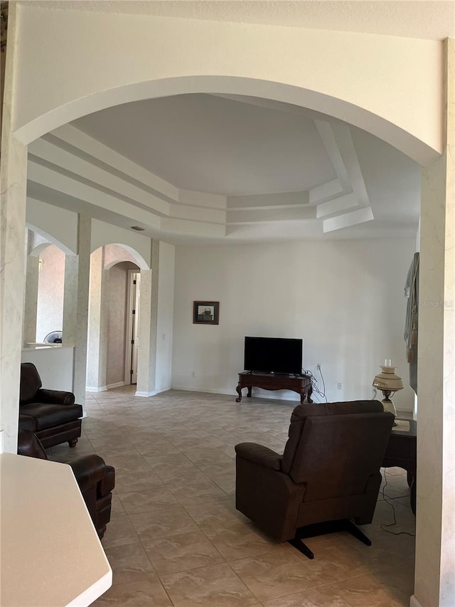 living room with a tray ceiling