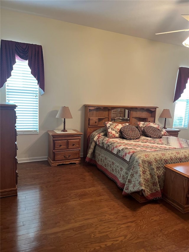 bedroom featuring ceiling fan and dark wood-type flooring