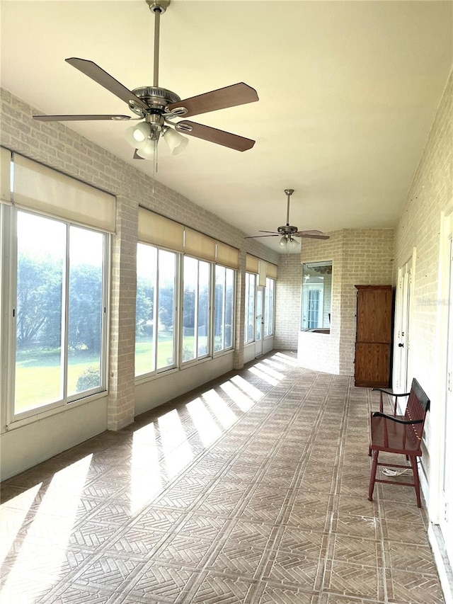 sunroom / solarium with ceiling fan