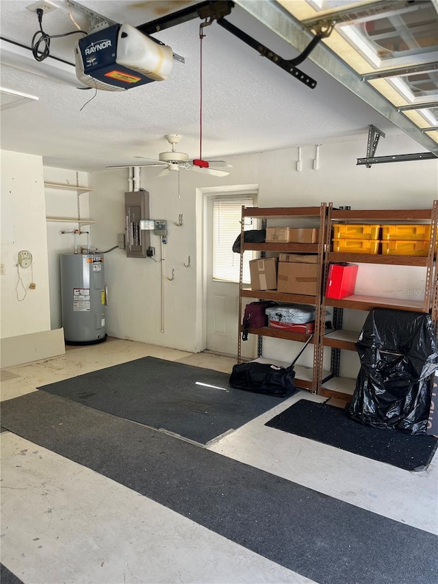 garage featuring a garage door opener, electric panel, ceiling fan, and electric water heater