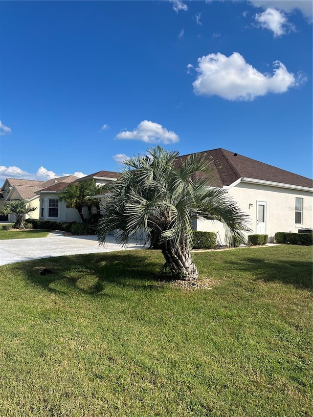 view of property exterior with a yard