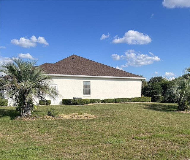 view of property exterior with a lawn