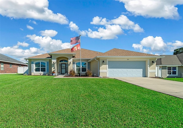 view of front facade featuring a front yard and a garage