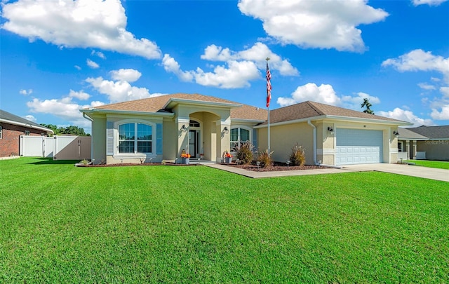 view of front of house with a garage and a front yard