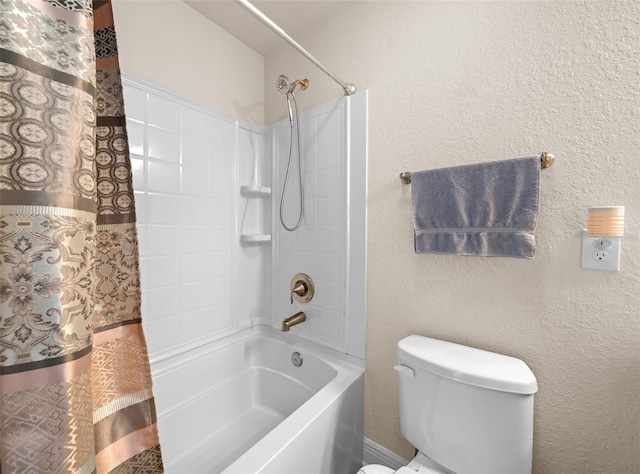 bathroom featuring shower / bath combo and toilet