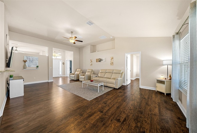 living room with ceiling fan, dark wood-type flooring, and vaulted ceiling