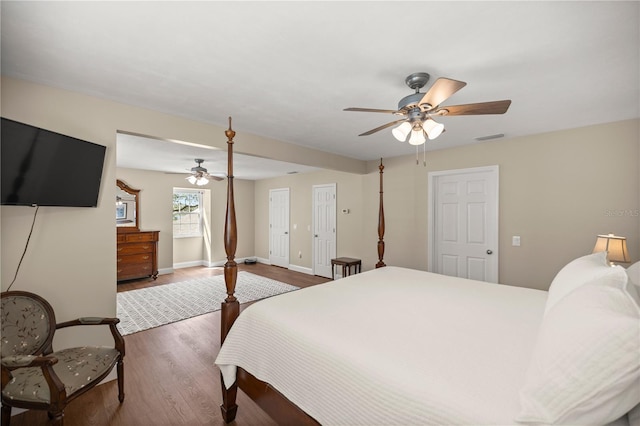 bedroom with ceiling fan and dark hardwood / wood-style flooring