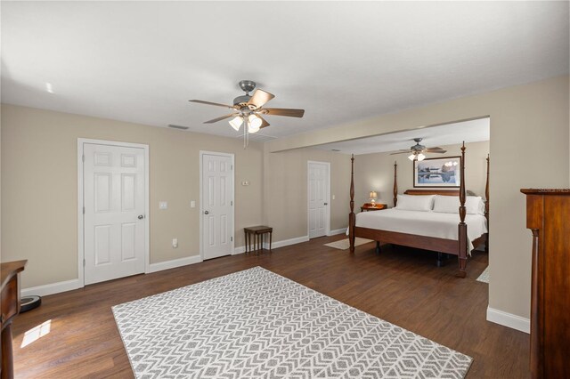 bedroom featuring ceiling fan and dark wood-type flooring