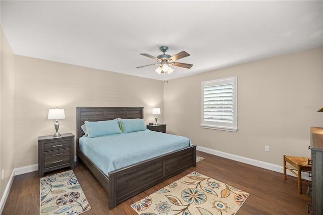 bedroom featuring ceiling fan and dark hardwood / wood-style floors