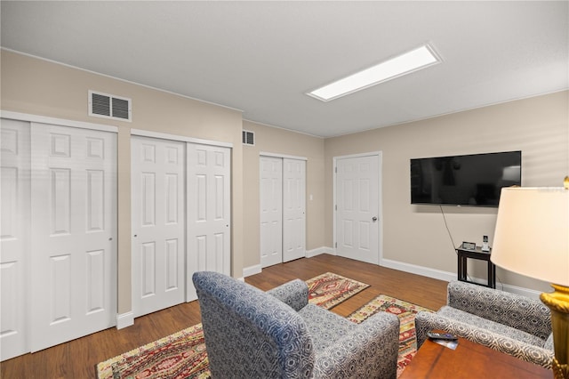 living room featuring dark hardwood / wood-style flooring