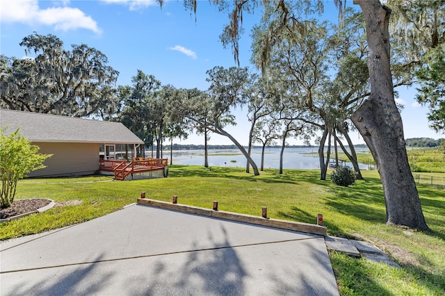 view of patio featuring a deck with water view