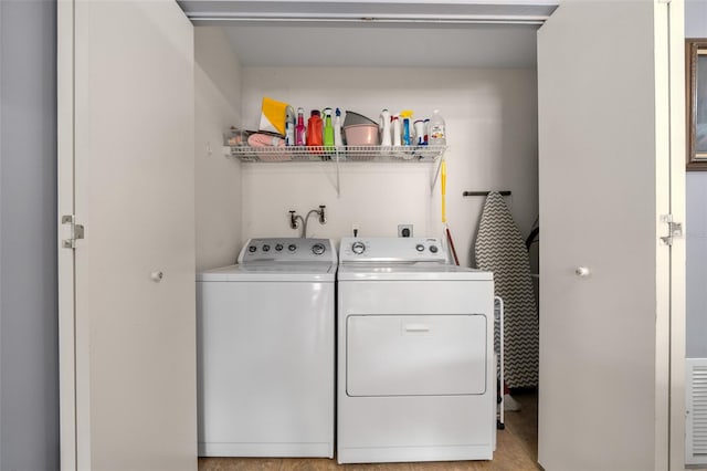 laundry room with washer and dryer