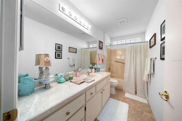 full bathroom with vanity, tile patterned floors, toilet, and shower / bath combo