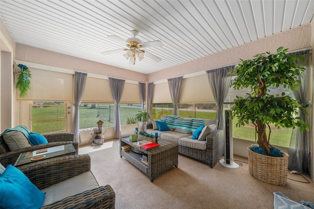 sunroom featuring ceiling fan