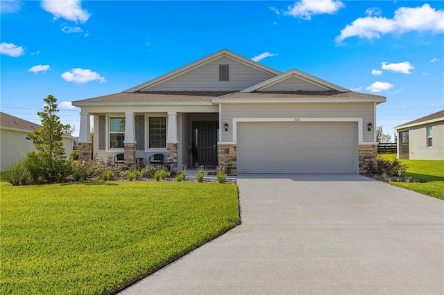 view of front of house with a front yard, a porch, and a garage