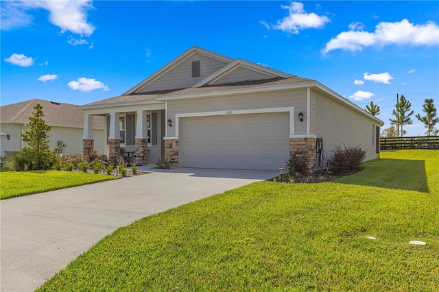 view of front facade featuring a front lawn and a garage