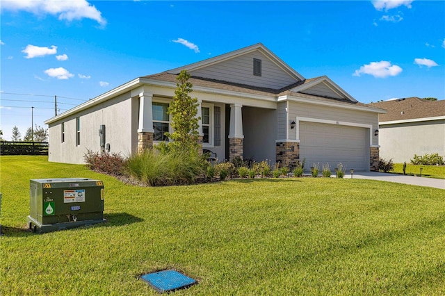 view of front of home with a garage and a front yard