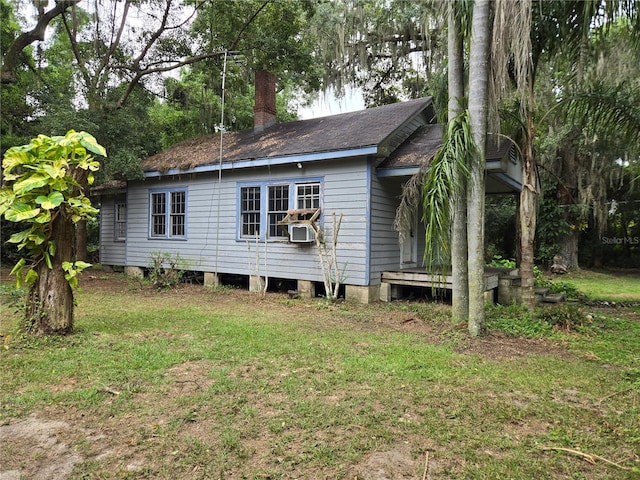 view of property exterior featuring a lawn