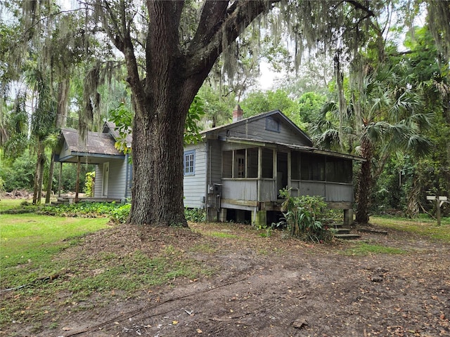 view of front of home with a sunroom