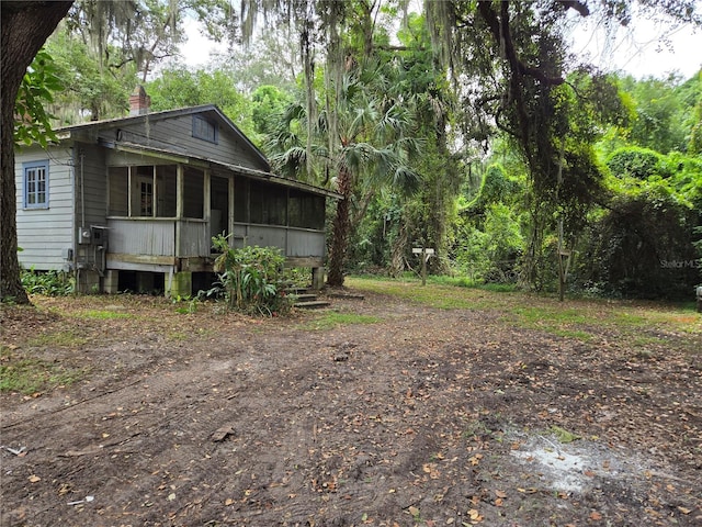 view of yard with a sunroom