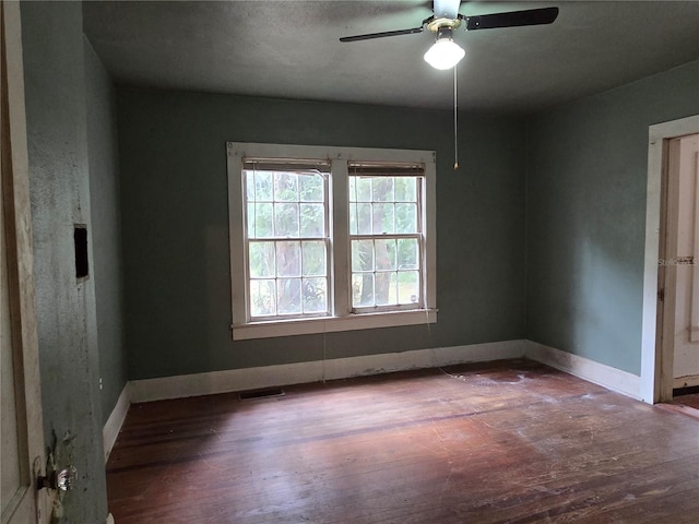 unfurnished room featuring ceiling fan and hardwood / wood-style flooring