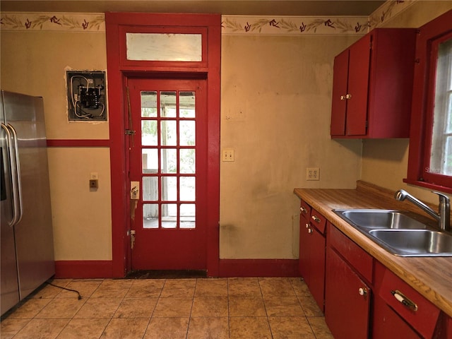 kitchen with sink and stainless steel fridge