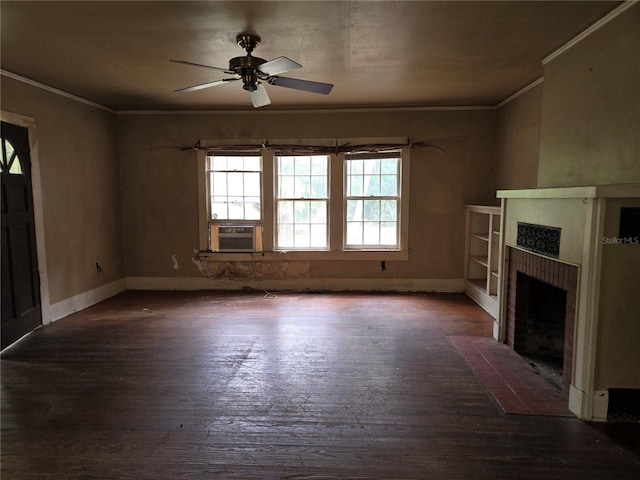 unfurnished living room with ornamental molding, ceiling fan, a tile fireplace, and dark hardwood / wood-style floors