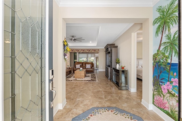 entryway featuring ceiling fan and ornamental molding