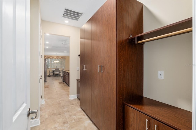 walk in closet featuring light tile patterned floors