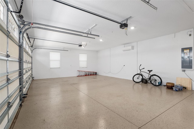 garage featuring a garage door opener, electric panel, and a wall mounted air conditioner