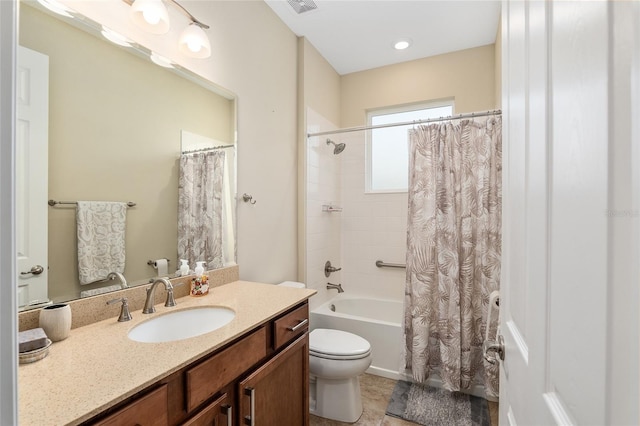 full bathroom with vanity, shower / bath combo with shower curtain, toilet, and tile patterned flooring