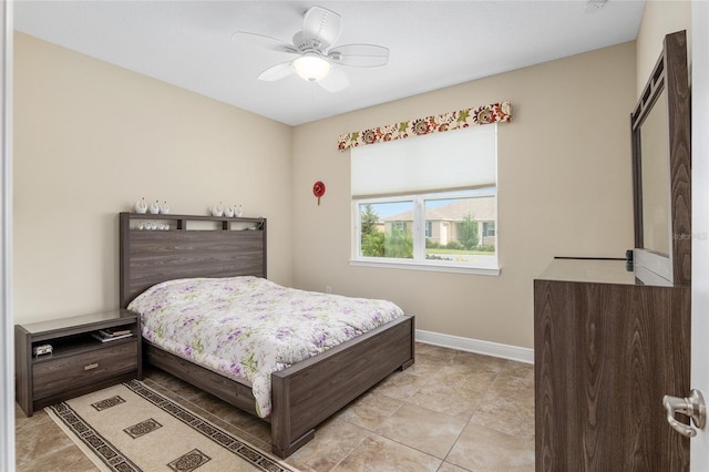 tiled bedroom with ceiling fan