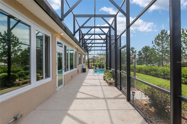 sunroom / solarium featuring a pool and a wealth of natural light