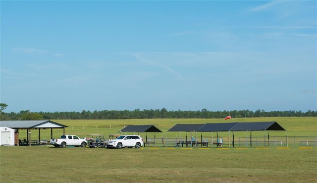 view of car parking with a yard