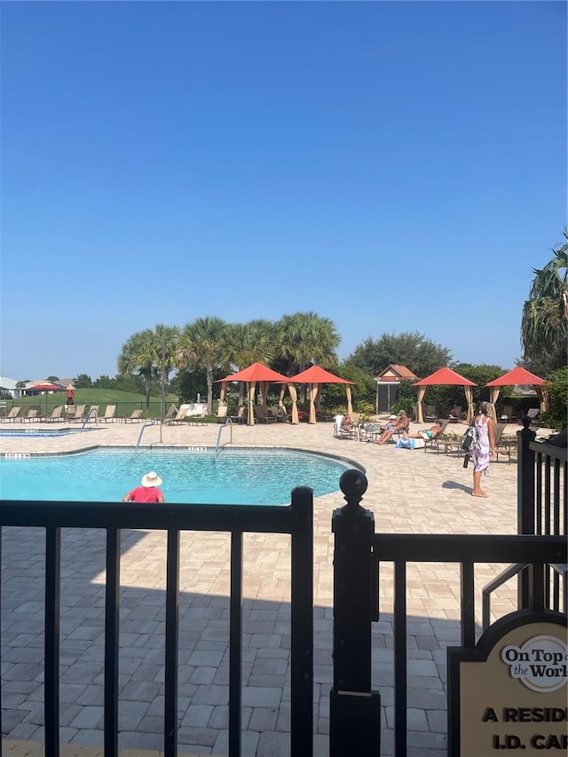 view of swimming pool with a patio