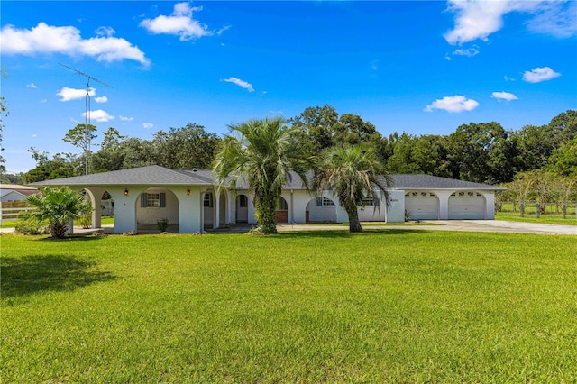 view of front facade featuring a front yard and a garage