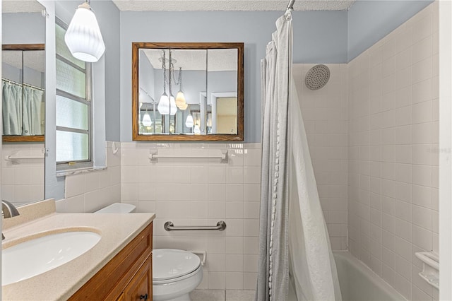 full bathroom featuring toilet, tile walls, and vanity