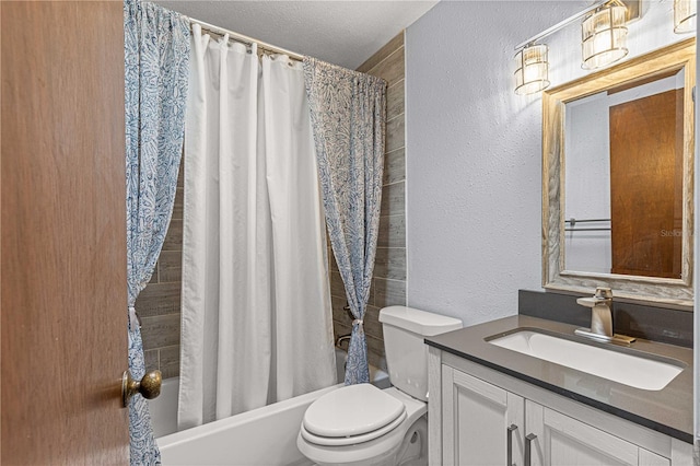 full bathroom featuring vanity, shower / bath combo with shower curtain, toilet, and a textured ceiling