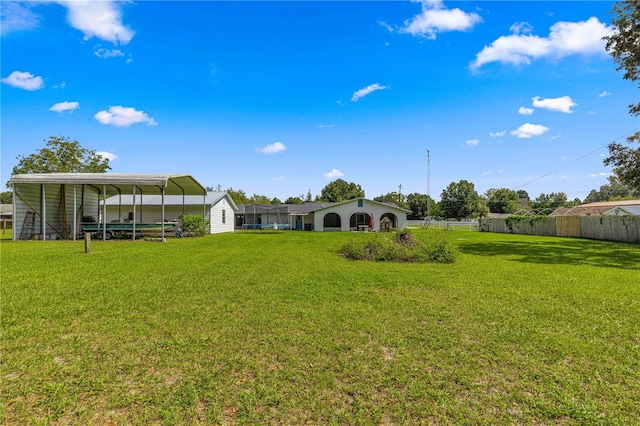 view of yard with a carport