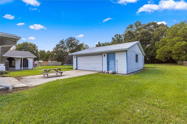 garage featuring a yard